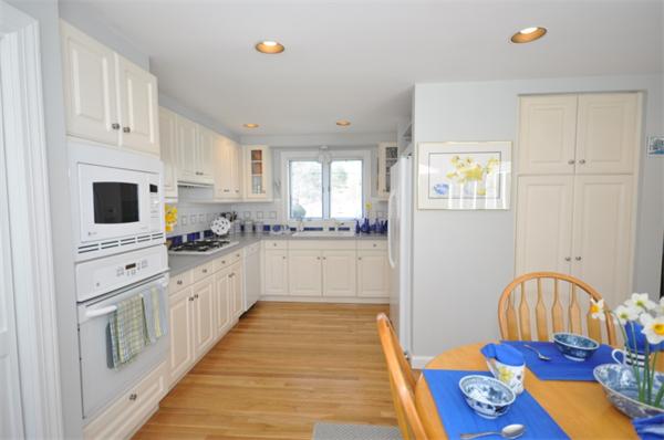 34 Valleyfield Street Lexington, MA 02421 - Photo 4 of 13 a large kitchen with stainless steel appliances granite countertop a stove and white cabinets