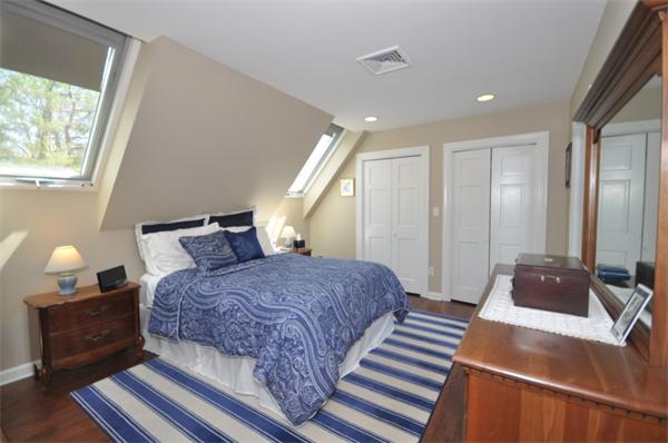 34 Valleyfield Street Lexington, MA 02421 - Photo 8 of 13 a bedroom with a bed and a couch