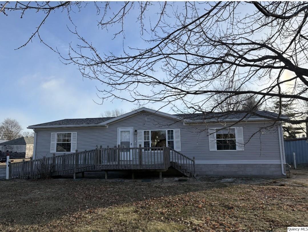 a house view with a backyard space