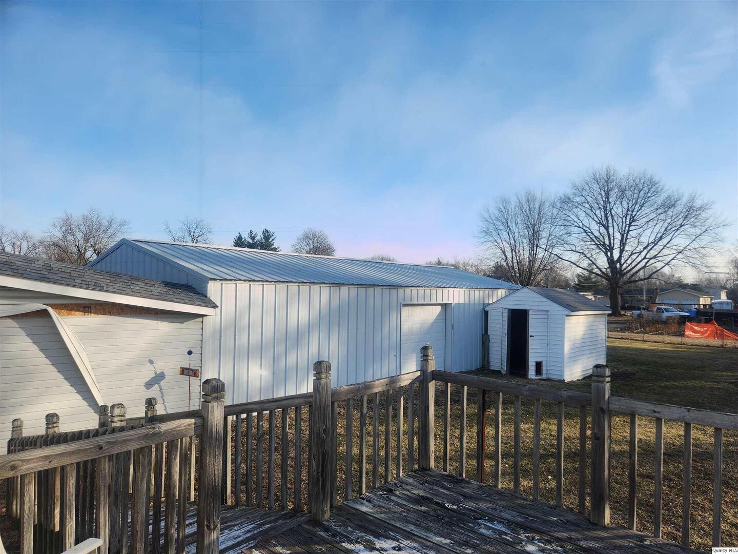 228 North Madison Street Carthage, IL 62321 - Photo 14 of 19 a view of a house with a balcony