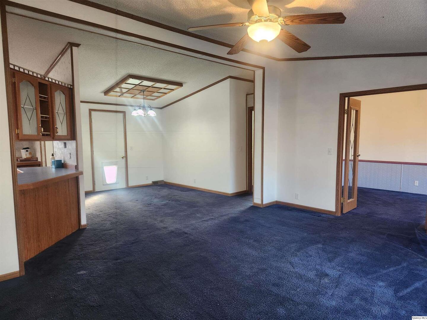 228 North Madison Street Carthage, IL 62321 - Photo 5 of 19 a view of an empty room with a window