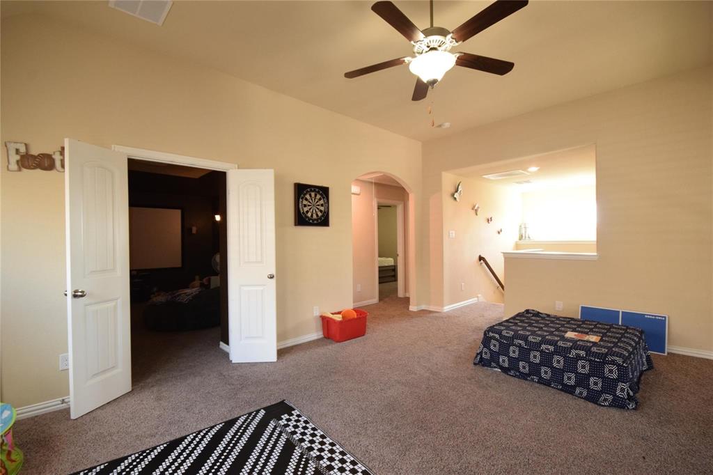 12421 Hitch Rack Way McKinney, TX 75071 - Photo 11 of 21 a living room with furniture and a ceiling fan