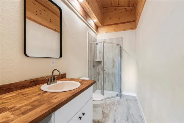 a bathroom with a sink and mirror