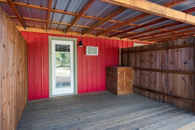 a view of a room with wooden walls