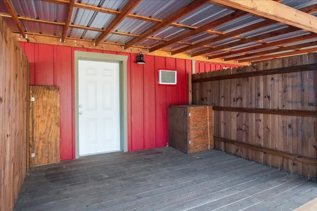 a view of a room with wooden walls