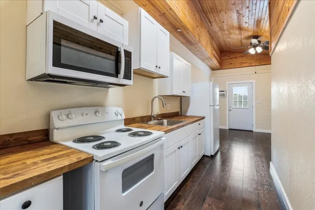 a kitchen with a stove and a microwave