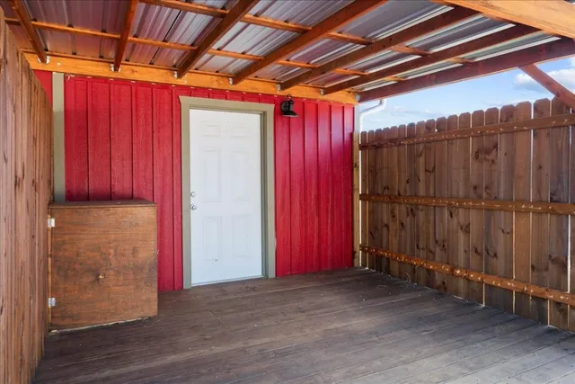 a view of a room with wooden walls