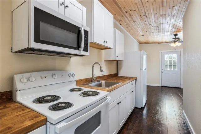 a kitchen with a stove and a microwave