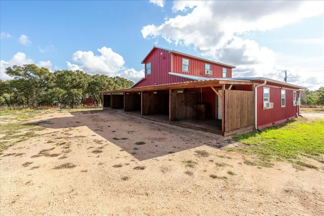 a view of a house with a snow in the yard