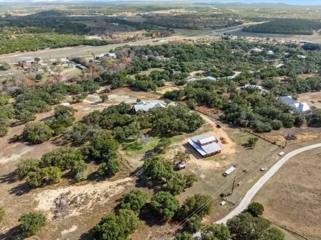 an aerial view of a house with a yard