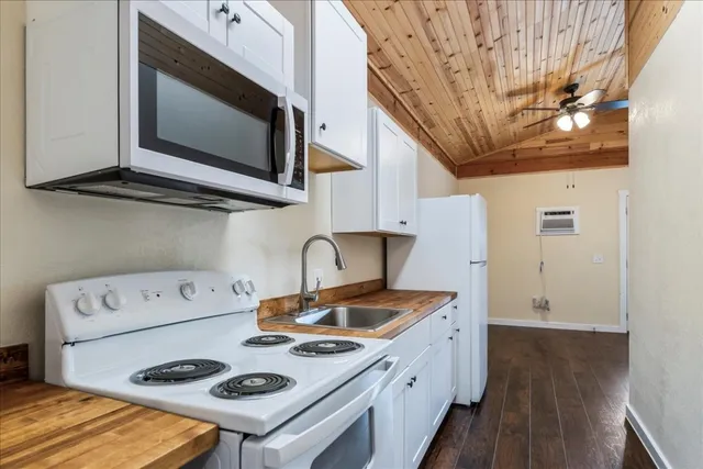 a kitchen with a stove and a microwave