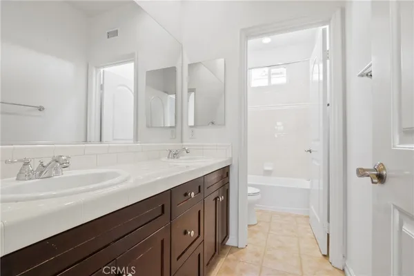 a room with dryer and cabinets