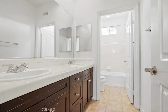 a room with dryer and cabinets
