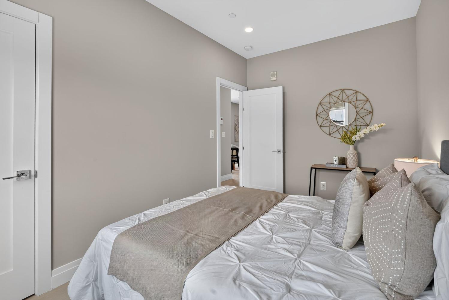 1102 Staples Street Northeast, Unit 301 Washington, DC 20002 - Photo 13 of 23 Second bedroom with modern elegance.