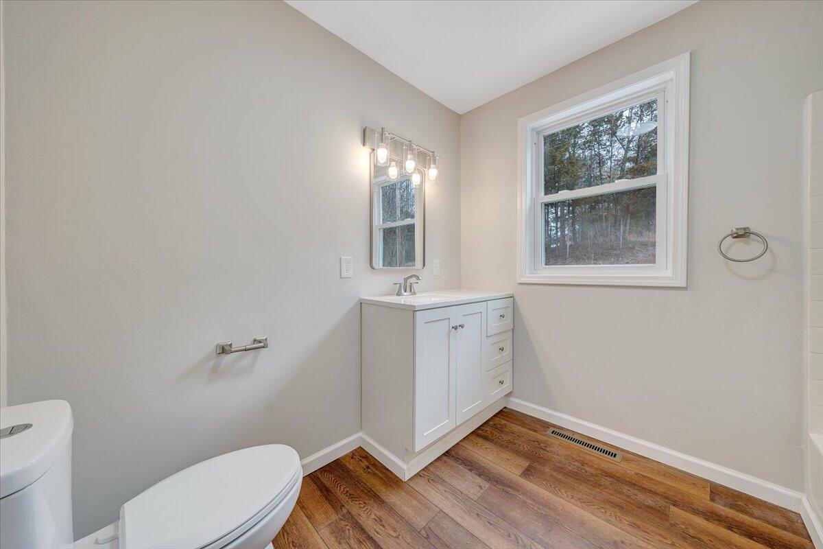 4160 Prillaman Switch Road Ferrum, VA 24088 - Photo 14 of 41 a bathroom with a toilet sink and mirror