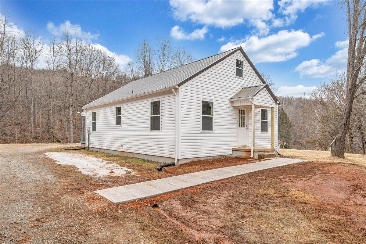 4160 Prillaman Switch Road Ferrum, VA 24088 - Photo 2 of 41 a view of a house with snow on the road