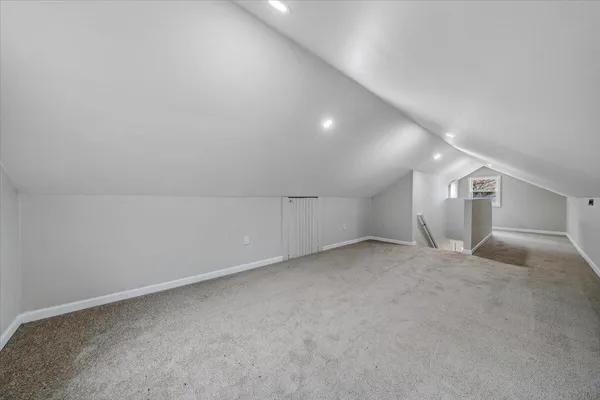 a view of empty room with wooden walls