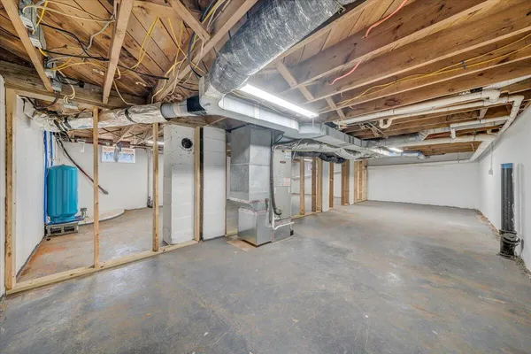 a view of empty room with wooden ceiling