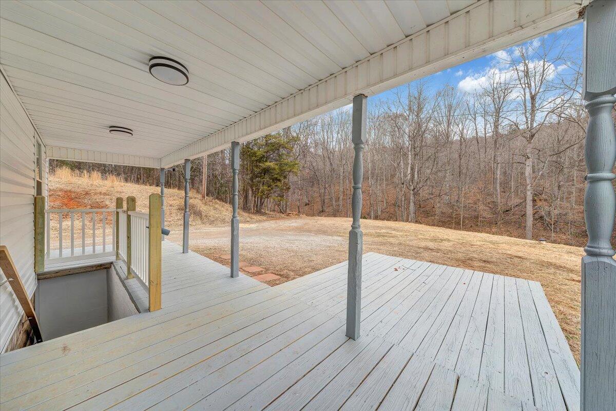 4160 Prillaman Switch Road Ferrum, VA 24088 - Photo 25 of 41 a view of a room with wooden floor and iron stairs
