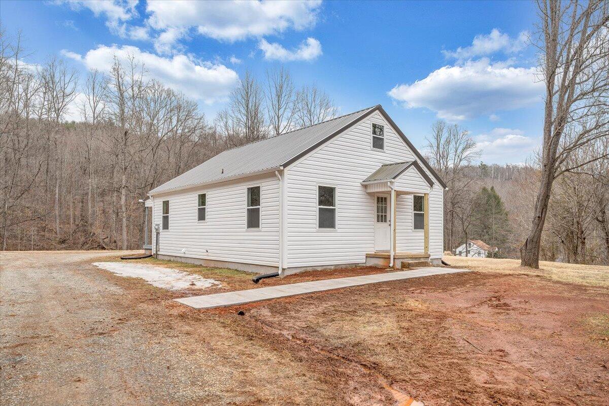 4160 Prillaman Switch Road Ferrum, VA 24088 - Photo 33 of 41 a view of a house with a yard