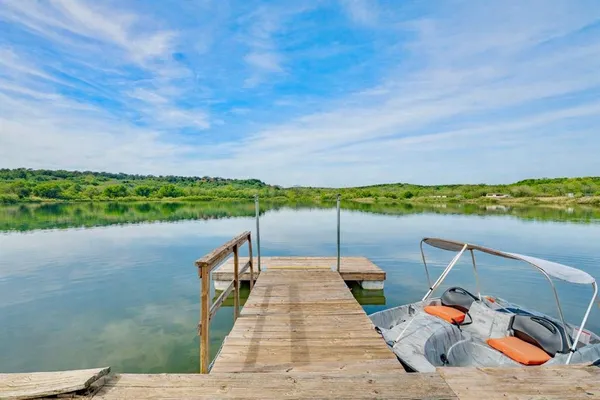 a wooden deck with sunset view