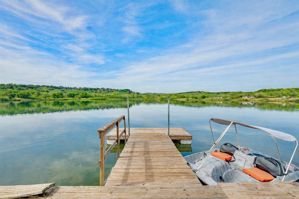 2013 Bedford Court Weatherford, TX 76087 - Photo 2 of 40 a wooden deck with sunset view