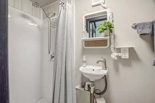 a view of a balcony with chairs and a table
