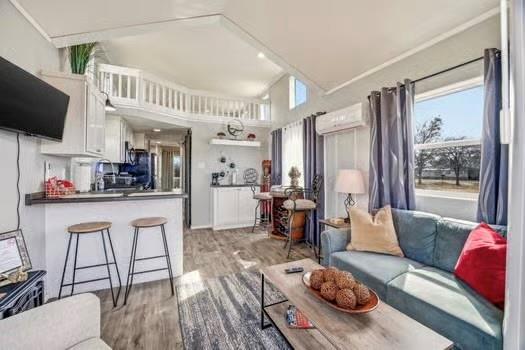 2013 Bedford Court Weatherford, TX 76087 - Photo 28 of 40 a living room with furniture and a flat screen tv