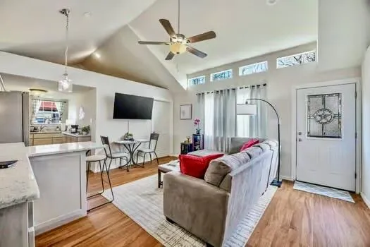 a living room with furniture and a table