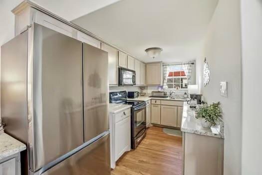 2013 Bedford Court Weatherford, TX 76087 - Photo 10 of 40 a kitchen with a refrigerator and a sink