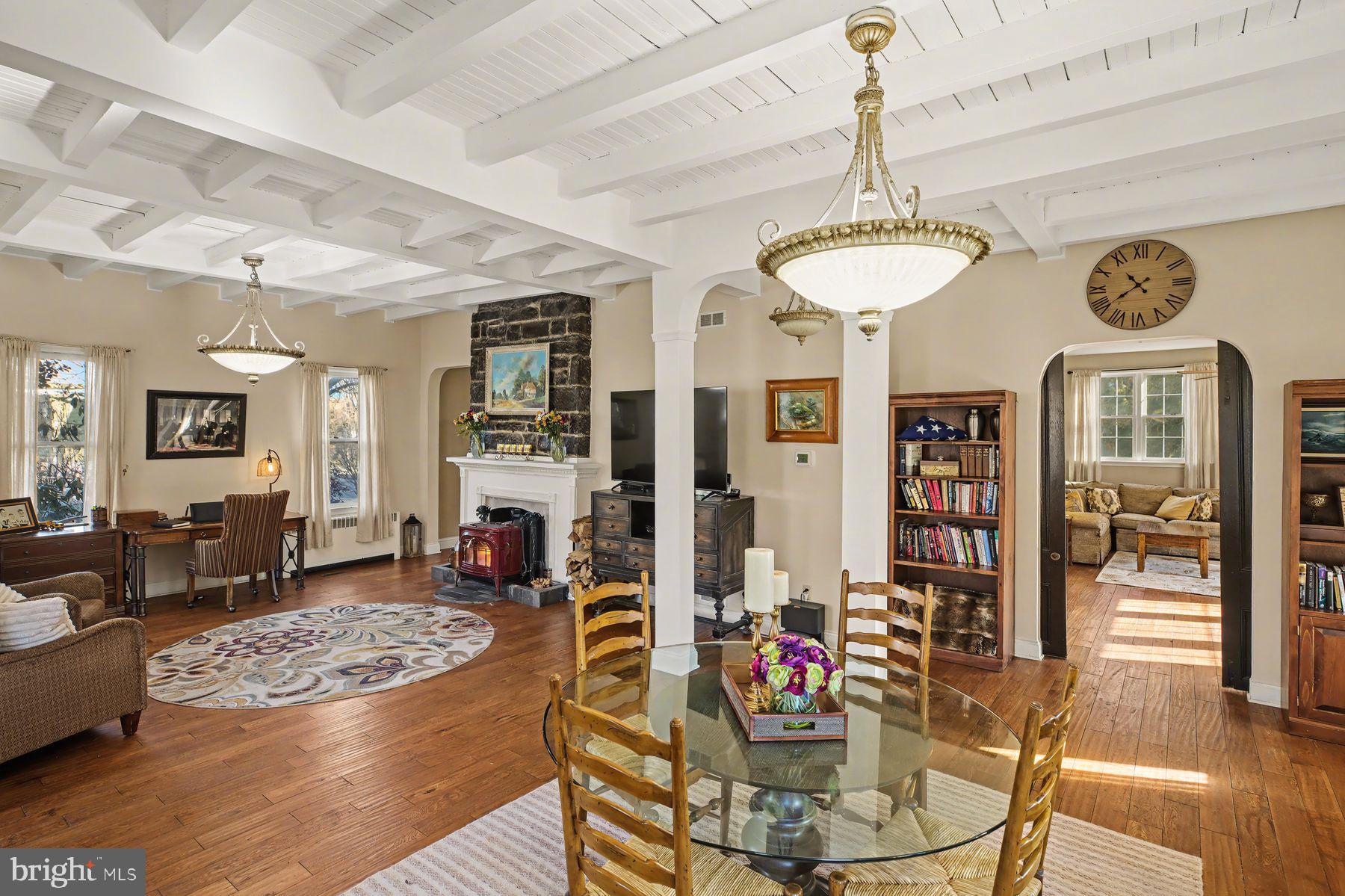 59 Byram Road Pipersville, PA 18947 - Photo 11 of 47 a view of a dining room with furniture a chandelier and wooden floor