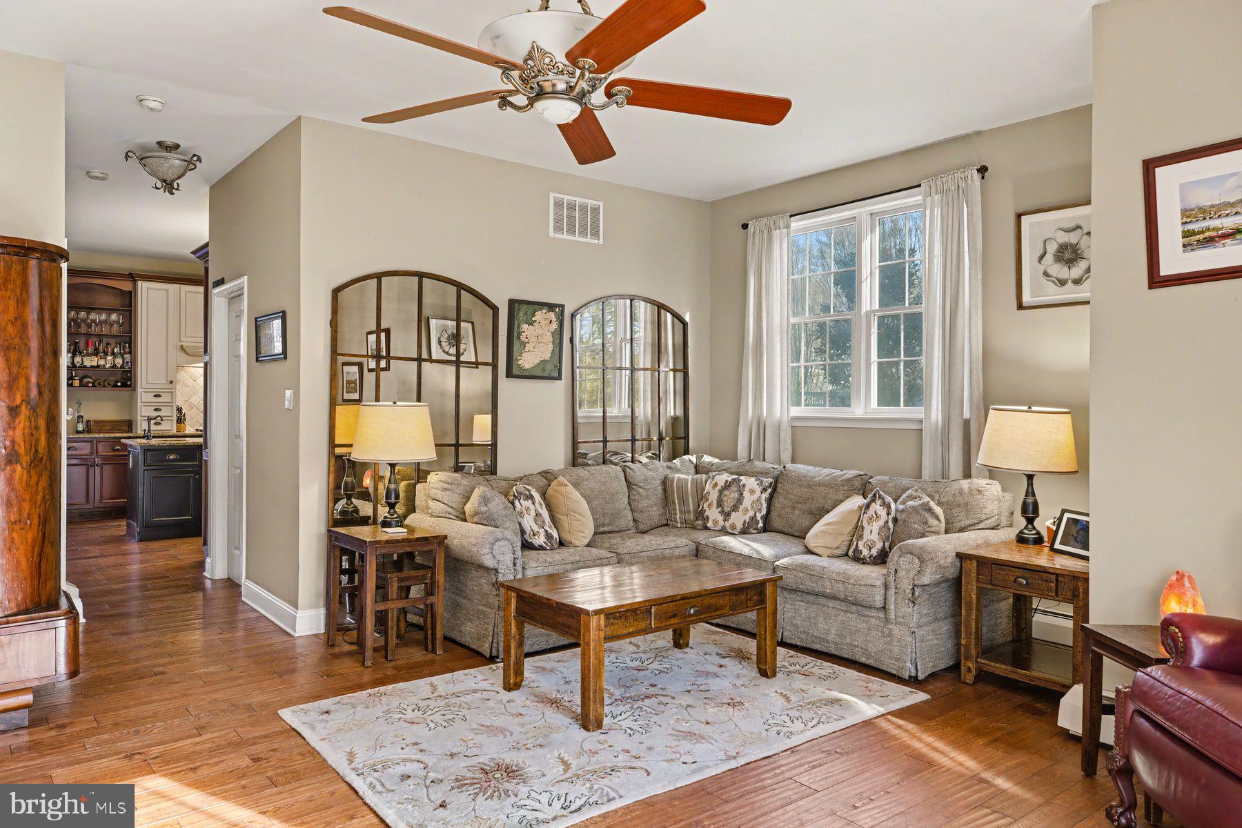 59 Byram Road Pipersville, PA 18947 - Photo 16 of 47 a living room with furniture a rug and a chandelier