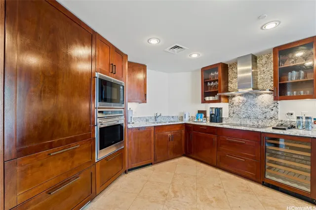 a kitchen with stainless steel appliances granite countertop a sink and cabinets