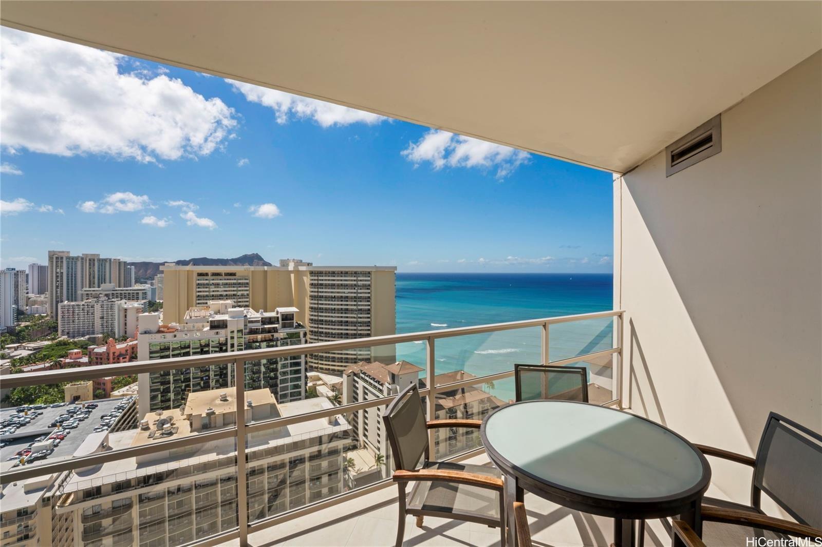 223 Saratoga Road, Unit 3208 Honolulu, HI 96815 - Photo 9 of 20 a view of a balcony with table and chairs