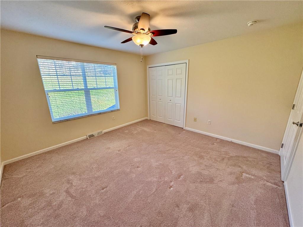 408 Chestnut Lane Apollo, PA 15613 - Photo 21 of 24 an empty room with windows and ceiling fan