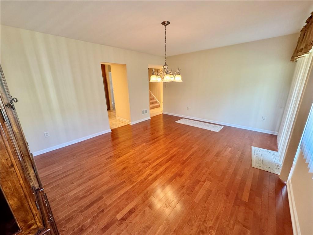 408 Chestnut Lane Apollo, PA 15613 - Photo 8 of 24 a view of empty room with wooden floor and fan