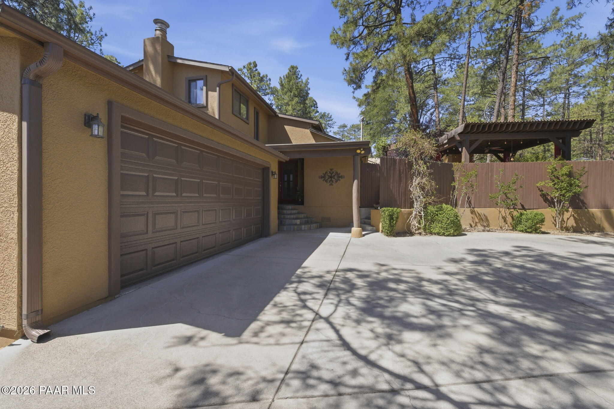 535 Copper Basin Road Prescott, AZ 86303 - Photo 7 of 41 a side view of a house with a yard and garage
