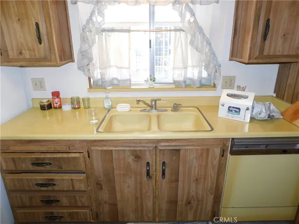 a white refrigerator freezer sitting inside of a kitchen