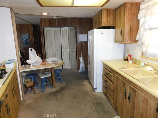 a kitchen that has a sink and a stove
