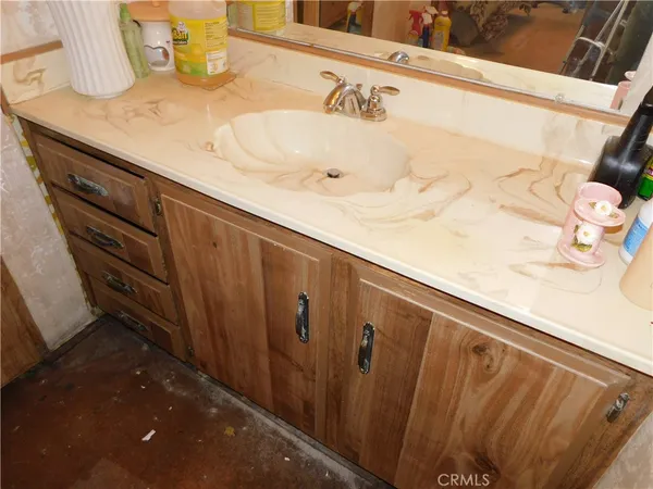 a bathroom with a shower and a glass door