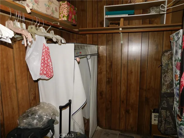 a bathroom with a toilet and a shower curtain
