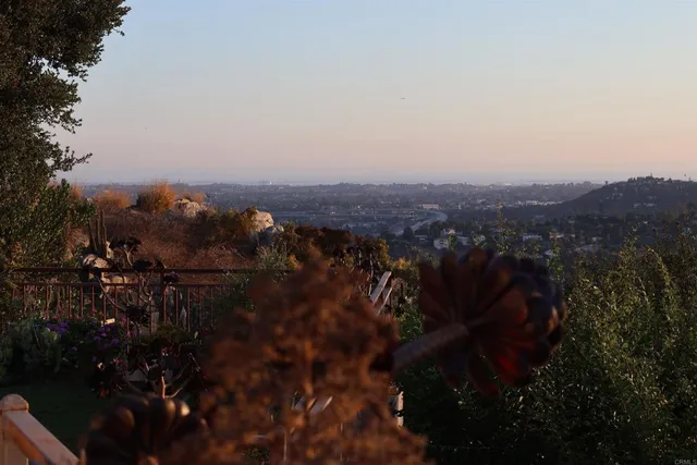 a view of a wooden house with a yard