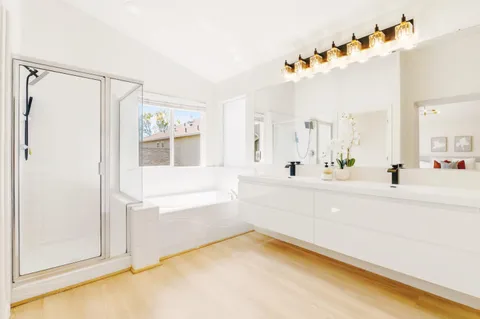 a bathroom with a bathtub and a sink