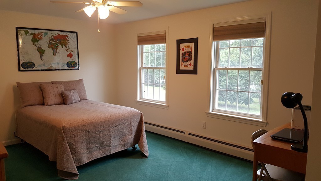 23 Calvin Street Ayer, MA 01432 - Photo 26 of 30 a bedroom with a bed and a window