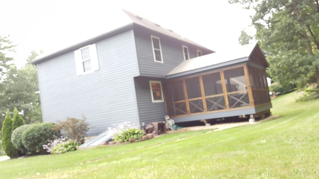 23 Calvin Street Ayer, MA 01432 - Photo 4 of 30 a view of a house with yard