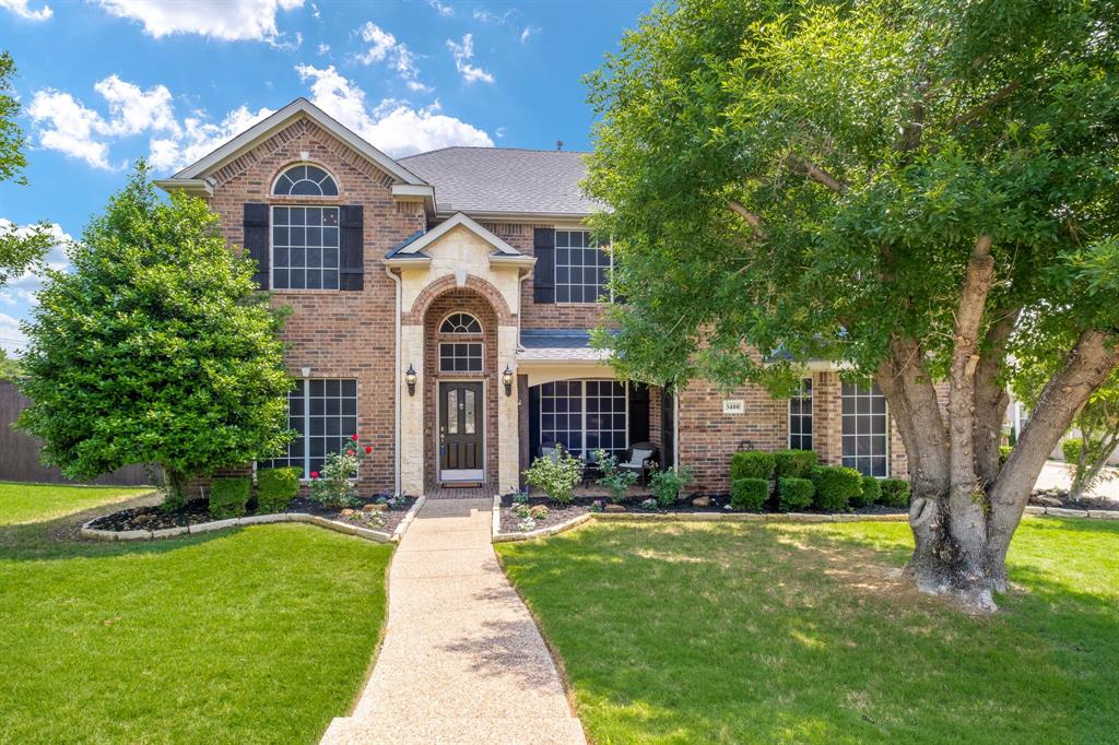 3400 Brookshire Run Corinth, TX 76210 - Photo 1 of 1 a front view of a house with a yard and trees