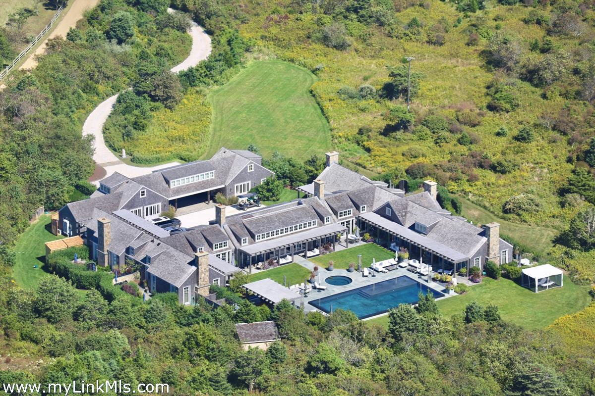 30 Crackatuxet Road Edgartown, MA 02539 - Photo 1 of 45 an aerial view of a house with a garden and lake view