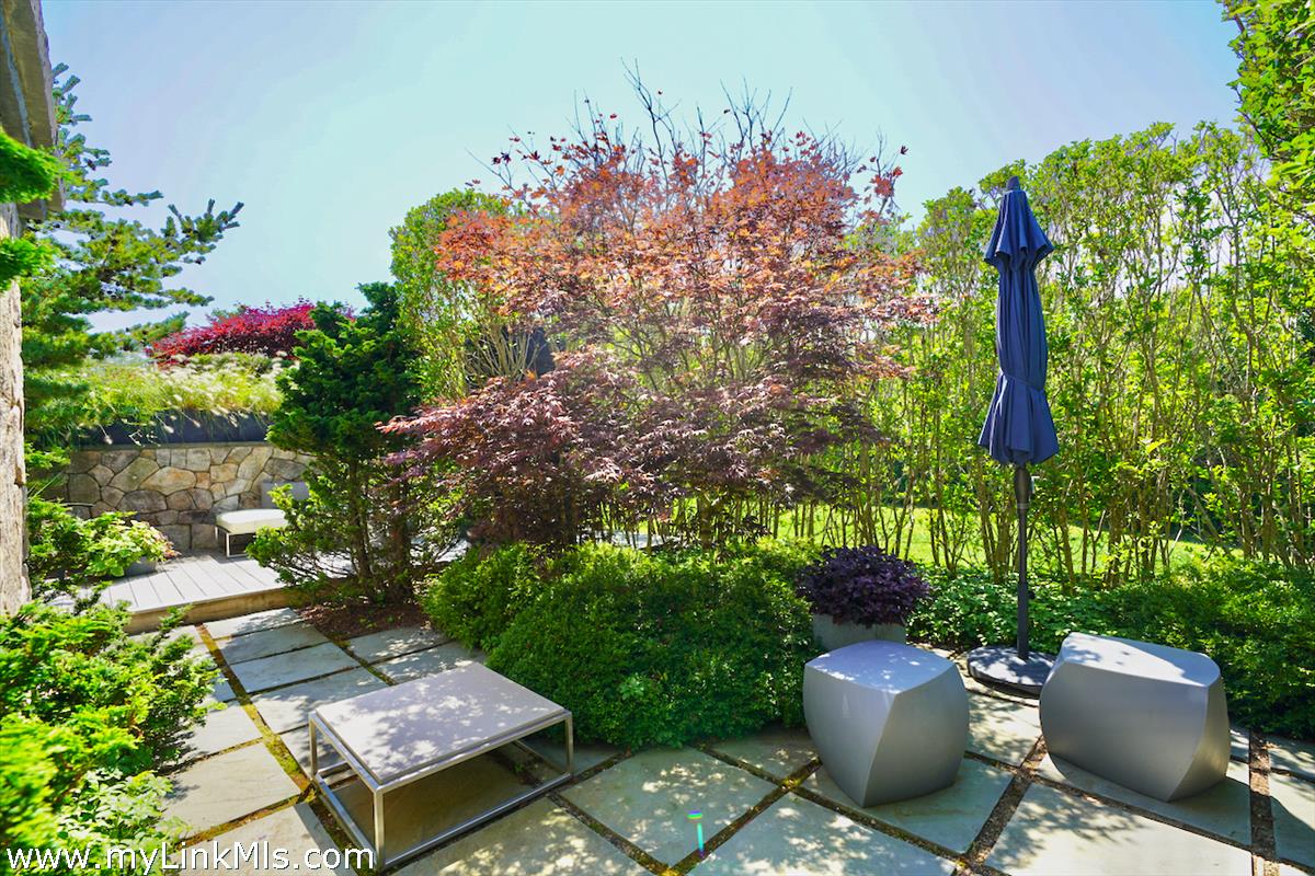 30 Crackatuxet Road Edgartown, MA 02539 - Photo 22 of 45 a view of a backyard with sitting area