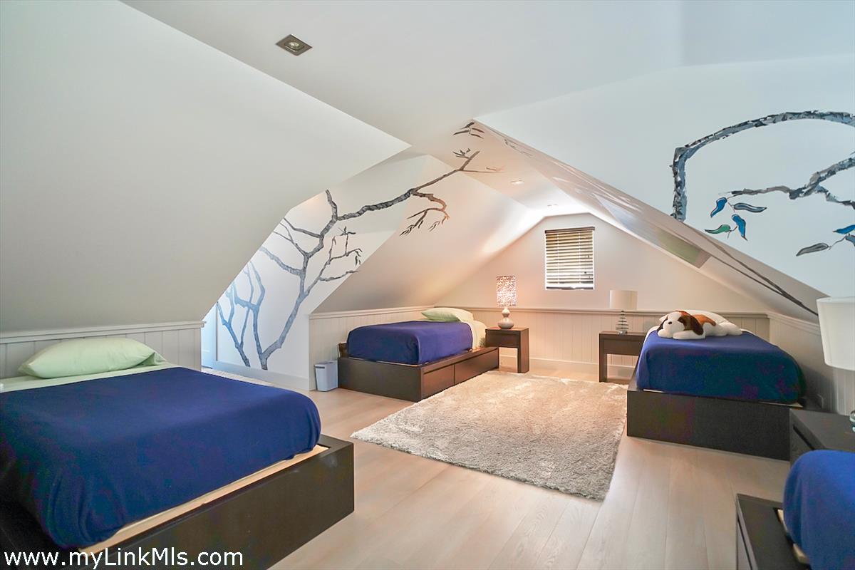 30 Crackatuxet Road Edgartown, MA 02539 - Photo 32 of 45 a bedroom with two beds and painting on the wall