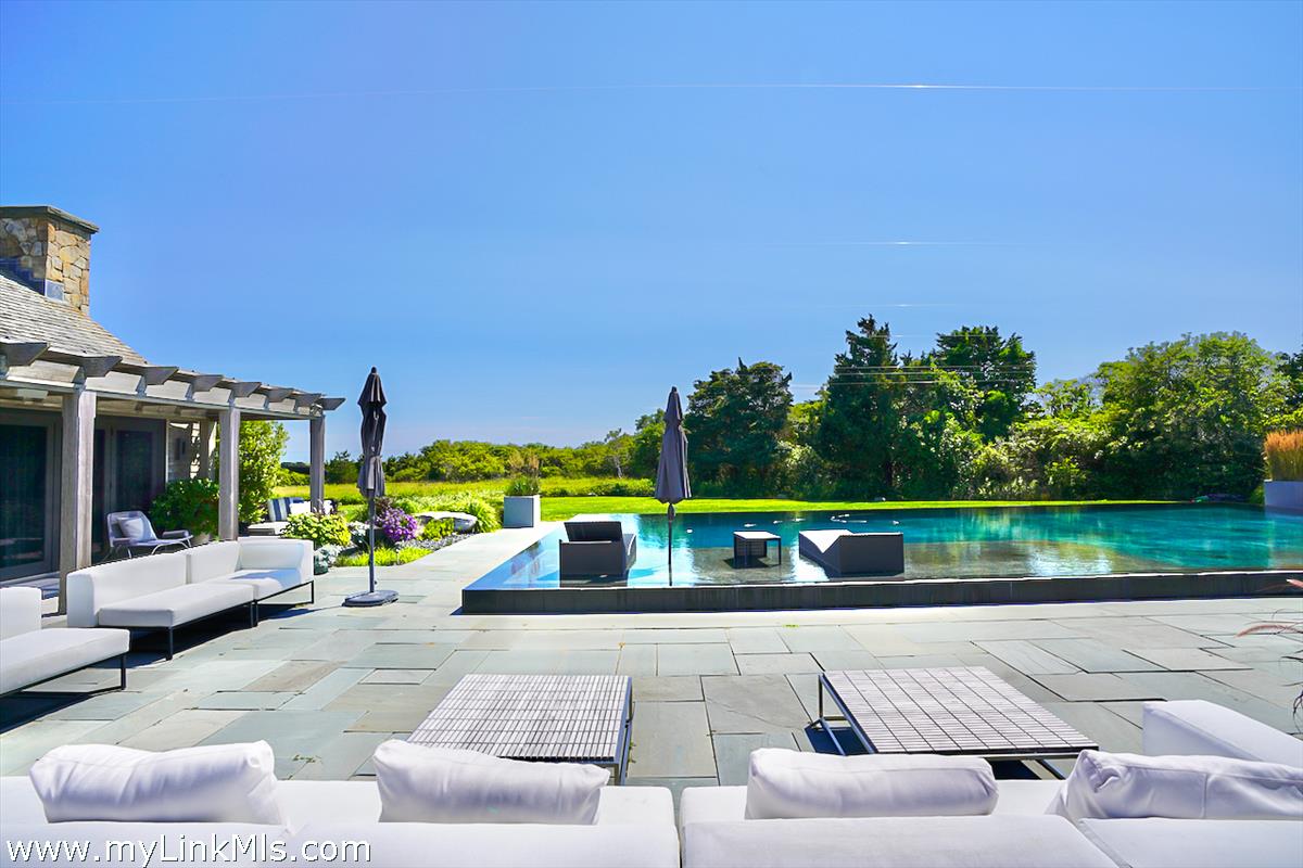 30 Crackatuxet Road Edgartown, MA 02539 - Photo 34 of 45 a view of swimming pool with a couches and lounge chairs